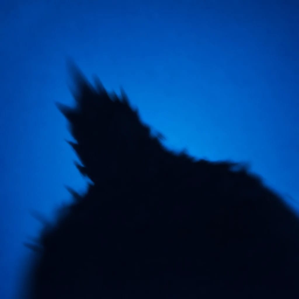 Stylized scene featuring a looming monster silhouette, softly out of focus, rendered in #004CB6