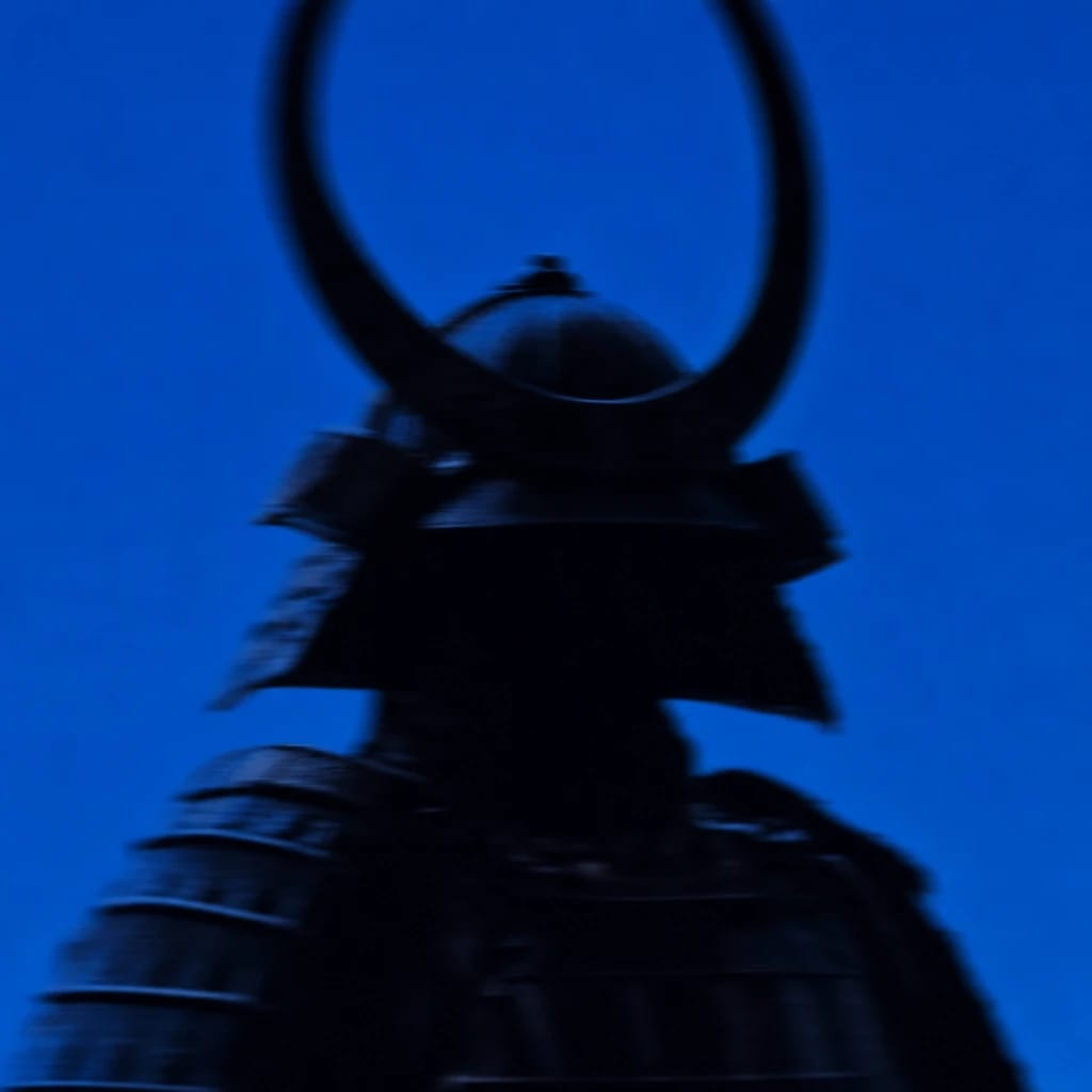 Stylized scene featuring a samurai in traditional armor, softly out of focus, rendered in #004CB6