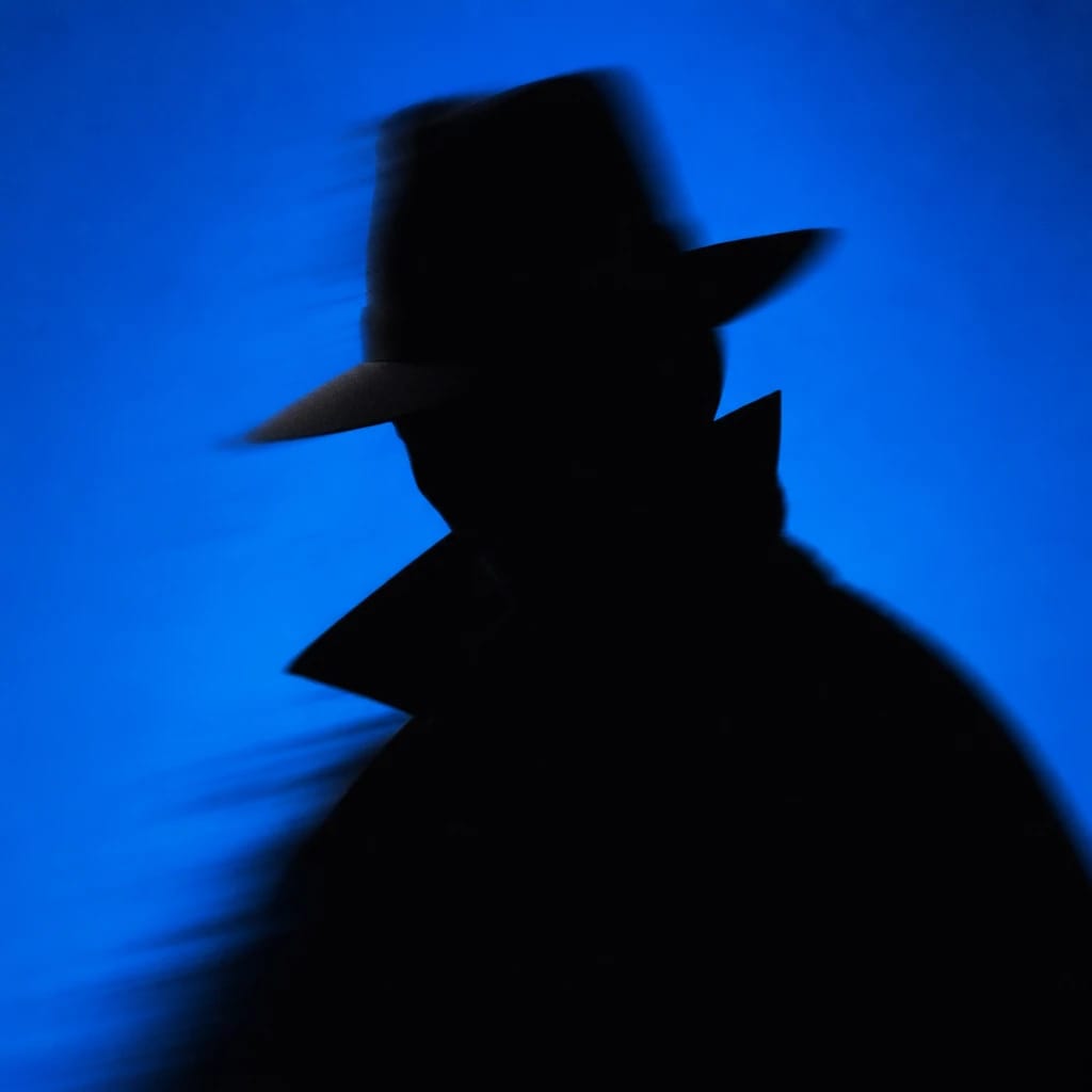 Stylized scene featuring a shadowy figure with a dramatic cape, facial features obscured, rendered in #004CB6
